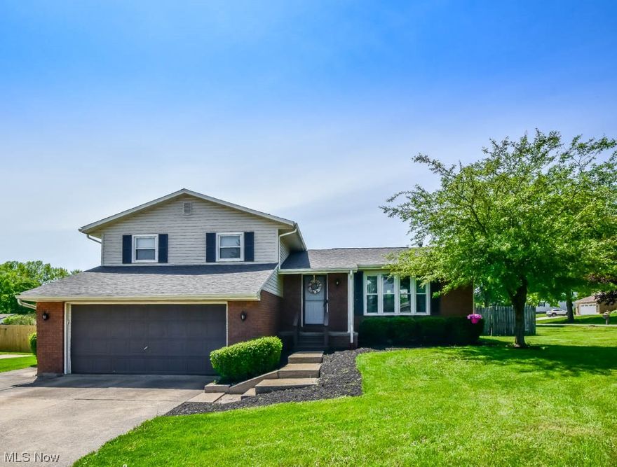 What a wonderful place to call home! The warm and inviting interior has a flowing floorplan between the living room with a picture window and eat in kitchen complete with tons of cabinet and counter space. Relax or entertain guests in the lower level family room featuring a cozy fireplace and walk-out to a covered patio. Down a few steps there's a separate rec room, a bonus room that could be used as a 4th bedroom, and a convenient half bath.  Upstairs are three more bedrooms with double closets including the master with private access to the full bath. Just as much to love outside with plenty of space for parking in the extended drive leading to an attached 2 car garage plus a fully fenced backyard with a swingset and a shed for added storage. Nicely updated with a newer roof, flooring, paint, light fixtures and ceiling fans with neutral decor throughout. Don't miss out on this beauty, call to see it today!