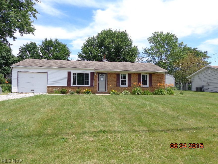 Ranch with brick front. Most siding on the side and back has been removed.  Needs some work. Great location.  Patio in the rear. Will make a nice home, once repaired.