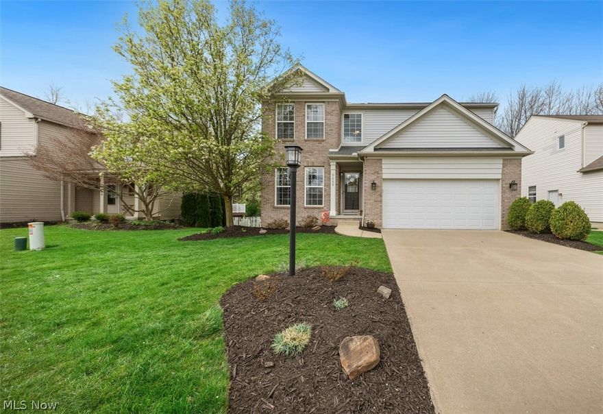 WELCOME HOME to this SPECTACULAR Colonial in Olmsted Township’s Woodgate Farms/Seton Village, and enjoy NO CITY TAX! Located in a 5-acre private roadway subdivision in Woodgate Farms w/a community pool, playground & clubhouse, this METICULOUSLY MAINTAINED home offers MANY RECENT UPDATES & is truly move-in ready! ALL APPLIANCES STAY including washer/dryer! A welcoming foyer opens to a versatile flex room, currently used as a home office, but easily adaptable as a dining room/playroom. Impressive 2-story great room features a wall of windows & abundant natural light, flowing into the kitchen with gleaming maple cabinets, an island with seating and storage, hardwood floors, a pantry, and a slider to the newly stained deck. Step down to a recent Unilock patio and a fully fenced backyard with plenty of room to play and entertain! (Swingset stays too!) A 1st-floor laundry and an updated half bath complete the main level. Upstairs, the spacious primary suite offers vaulted ceilings, a large walk-in closet, and an ensuite bath with a double vanity. 2 addl' bedrooms and an updated full bath complete the 2nd floor. The 1,040 sq ft basement features 9-ft ceilings, a carpeted rec room w/garden daylight windows & ample storage. Some of the RECENT UPDATES INCLUDE: Stainless Steel appliances, SimpliSafe Security System, ALL new interior & exterior light fixtures, new sump pump w/battery backup, ENTIRE interior freshly painted, front door painted, new blinds all windows, radon mitigation system, Nest thermostat, HVAC cleaned & serviced (2026), updated baths, new basement door, garage door spring, landscaping refresh, newly stained deck, dusk-to-dawn lamp post sensor, playset, added a subpanel & outfitted the garage for EV charging (but the actual Tesla charger does not stay) ONE-YEAR HOME WARRANTY for peace of mind! Call TODAY for a private showing before this one is gone, baby, GONE! *Sellers may need extended possession until mid-June, dependent upon when their new home is ready.