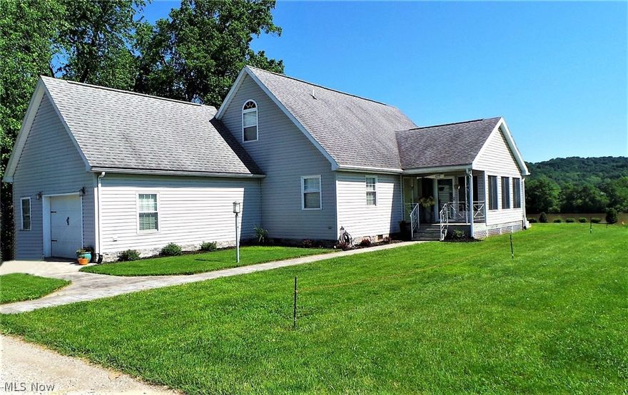 Rare find! Ohio River frontage-with a beach-not in flood zone-not on top of a hill. Huge deck for enjoying the full river view. Back of house is all glass including sun room and upstairs loft. Open floor plan with fresh bright kitchen open to dining area which is open to the living room. Cathedral ceilings open to walkway with view of kitchen and living room and to the loft with full view of river.