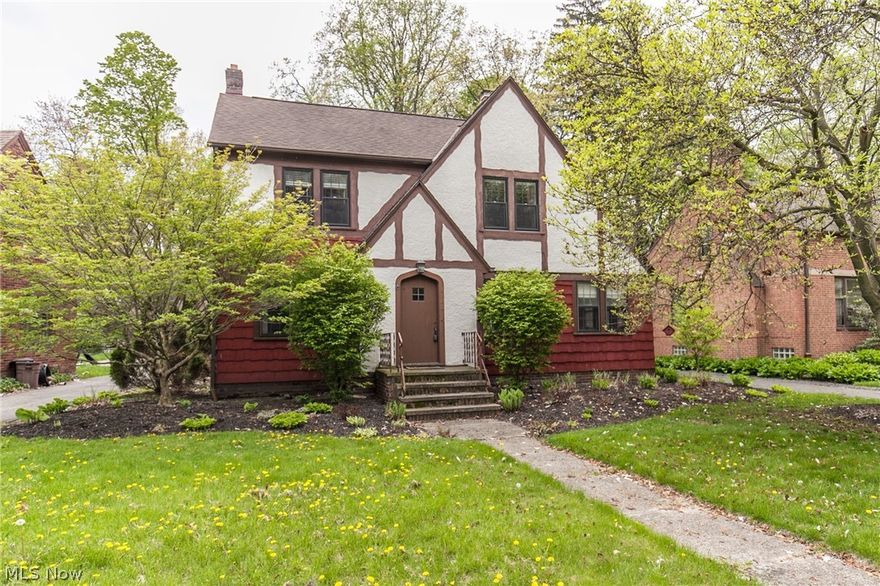 Pride of ownership abounds in this absolutely gorgeous and meticulously well maintained 3 bedroom Tudor. Neutral decor and beautiful architectural details throughout - the interior boasts a wonderful eat in kitchen with maple cabinets, granite counters, tile back-splash, loads of cabinet/counter space and all appliances stay. Spacious living room w/ wood burning fireplace and lots of natural sunlight. First floor den/library. Gleaming hardwood floors. Gorgeous crown molding and trim. Five window AC units stay. Formal dining room w/ built-in corner cabinet (leaded glass window). Wonderfully appointed bedrooms. Master w/ dual closets. Lovely second floor sun room overlooking the private back yard. Walk up third floor attic -  for all your storage needs or it could be easily converted into a 4th bedroom or bonus room.  Sprawling rear deck is perfect for entertaining or relaxing. Many vinyl windows. Home warranty. This is an exceptional home, location and opportunity!!!