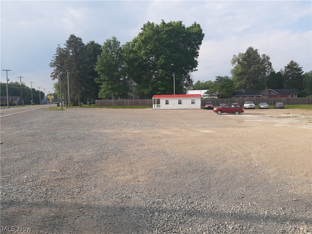 This listing is a FOR LEASE ONLY!! Up to 2 acres available. Level lot with a 10' x 20' mobile office/shed with electric. Ideal for a used car lot or parking area. Owner will consider building to suit and leasing the new structure. (Owner may need time to empty lot if there is interest in all of the 2 acre lot)