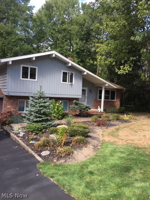 Agent owned 4 level split home. BEAUTIFUL back yard for relaxing or entertaining with three cedar wood decks,two ponds (one which has Koi and gold fish), and a bridge crossing over a creek. Home features oak floors in bedrooms as well as the living and dining rooms. Dining room sliding glass door opens out to an attached cedar deck. Kitchen has cherry wood floors, granite counters and stainless steel appliances. Family room has a stoned wood burning fireplace with hearth and Sliding glass doors that open to your stoned in mini outdoor kitchen area and a stamped concrete patio with cedar deck and fire pit. Outdoor grill is on a gas line. Lower level full bath has heated floors. All windows are energy efficient. Whole house alarm system. Drip system in front-yard garden has controls tied into water line in basement. Hard-wired heat cables with on\off switch in basement. Outdoor electrical outlets in front and back yards. Outdoor speakers. A must see to believe.