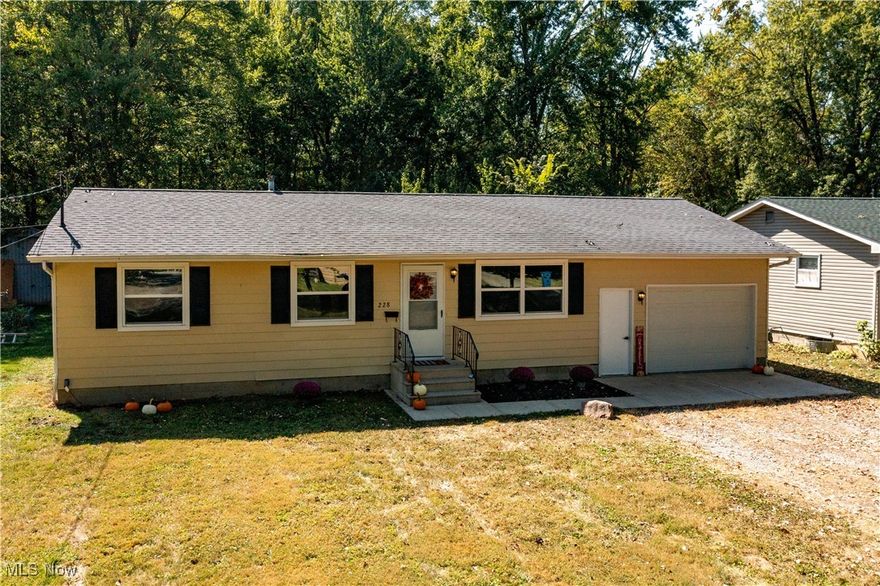 Warm and welcoming home! You will love this fabulous ranch featuring freshly painted walls throughout the eat-in-kitchen, living room, 1 full spacious bathroom, 3 bedrooms with spacious closets and many updates. The bedrooms feature new carpet and check out the new luxury vinyl flooring tastefully chosen. Entertain in this lovely kitchen with plenty of cabinet space and the microwave, range and dishwasher are included. The entryway from the back into the kitchen is a plus. The basement is very spacious and ready for your storage. The garage is huge with a garage door opener.

If you are looking for easy living and a cozy home, this is it. Check out the large concrete patio in the back looking over a park-like peaceful setting and watch the deer play while listening to the beautiful sounds of songbirds. This lovely ranch is a great choice conveniently located close to St Rt 58 and St Rt 18 and close to Findley State Park.

Move right in and have fun adding your personal touches and call it your own.