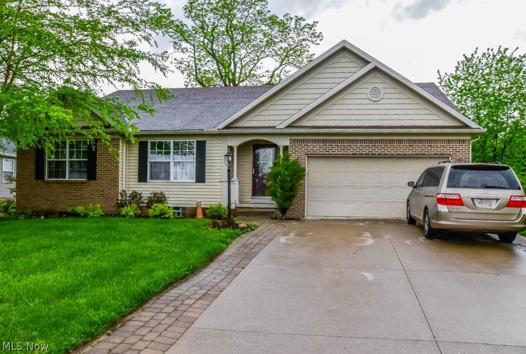One floor living at its best! Beautiful split bedroom ranch with a finished lower level in a great neighborhood! Open floor plan with high, vaulted ceilings and hardwood floors throughout the main living space. Relax in the spacious great room with a gas fireplace and surround sound connections. Prepare your favorite dishes in the wonderful kitchen with a 6 burner Viking countertop range, double wall ovens, pantry with automatic light, stainless steel appliances, island with bar and lazy Susan in the corner cabinet. An arched doorway leads to the bright and cheery formal dining room. Back sun room with access to the patio. 1st floor laundry room with utility sink, washer and dryer included! The large master suite offers a walk-in closet, dressing/sitting room and a private full bath with double vessel sinks, separate shower and garden tub. 2 additional bedrooms and a second full bath on the main level. Extra living space on the finished lower level with glass block windows, 2 rec rooms