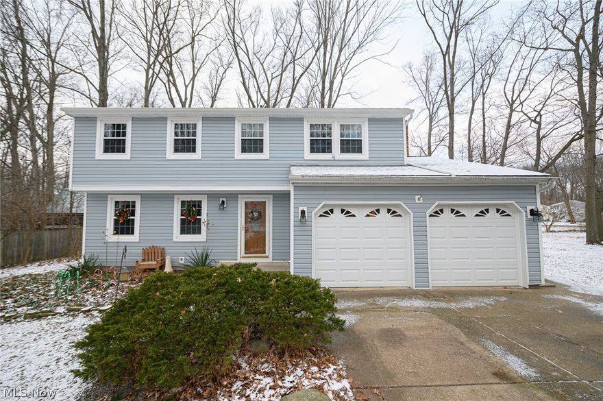 Spacious Colonial home on a private wooded lot just minutes from shopping and freeway access! The home itself features plenty of updates including upgraded Kitchen with corian counter tops, new carpets upstairs , updated fixtures throughout the home,extended deck, newer furnace, hot water heater and Four Bedrooms! Plenty of additional living space with both a family and living room (plus the bonus sun room! ) Sun room can be used all four season's with the wood stove fireplace and warm the whole house during the colder months! Outside the extended deck creates a great spot for entertaining!  Lower level is partially finished in with a Full Bathroom. Garage door replaced in 2010 and majority of doors on the house have been replaced. House comes equipped with electric fence for your pets! Great value for the area. Set your appointment today to view this home!