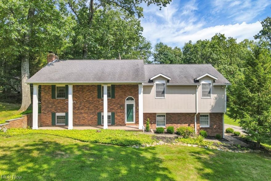 Spacious Split-Level on a beautiful half acre+ lot in the Stonehenge Subdivision. 3 bed, 2 1/2 bath, 2 car garage. Features a 528 sq ft+ great room with skylights and plenty of windows for wonderful natural light. Great room leads onto a wraparound deck for entertaining or enjoying morning coffee! Kitchen features custom cabinets galore with lots of storage space. Spacious bedrooms. Large living room with a fireplace. Lower level has family room w a fireplace and 1/2 bath. House being sold AS IS.