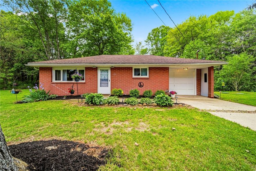 Tucked away on a quiet dead-end street is where you'll find the cutest brick ranch on 0.68 acres that you'll ever see! Recent improvements make this home truly move-in ready, including fresh paint, new flooring, a 200-amp electrical service upgrade, and a newly installed septic system and leach field approved by the City of Conneaut. The spacious kitchen offers a breakfast bar and opens to the main living area, and offers convenience with first-floor laundry. The existing layout also allows for a second bedroom with minimal modification. Outside, you'll appreciate the attached one-car garage, concrete driveway, generous side yard, and peaceful backyard overlooking a ravine. Whether you're looking for a weekend retreat near Conneaut and Lake Erie, a short-term rental investment, or a low-maintenance home to downsize into, this property offers outstanding flexibility and value.