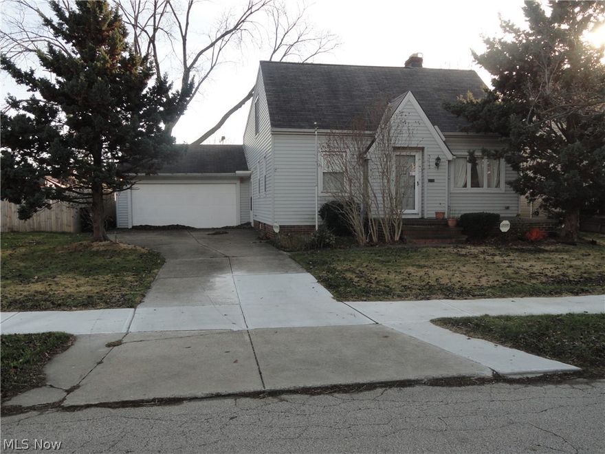 Four bedroom home with 2 full baths, two car attached oversized garage and operator, with overhead door on the rear wall for easy access to the backyard, and also a 1 car garage, with attached covered patio. Sliding doors off the kitchen leads to a large beautiful brick patio for all your Parties/cookouts. Full partially finished basement. Complete privacy fenced yard.  Very close to I480 access ramps. Don't hesitate, won't last long, Call Joe for your appointment to see this home.