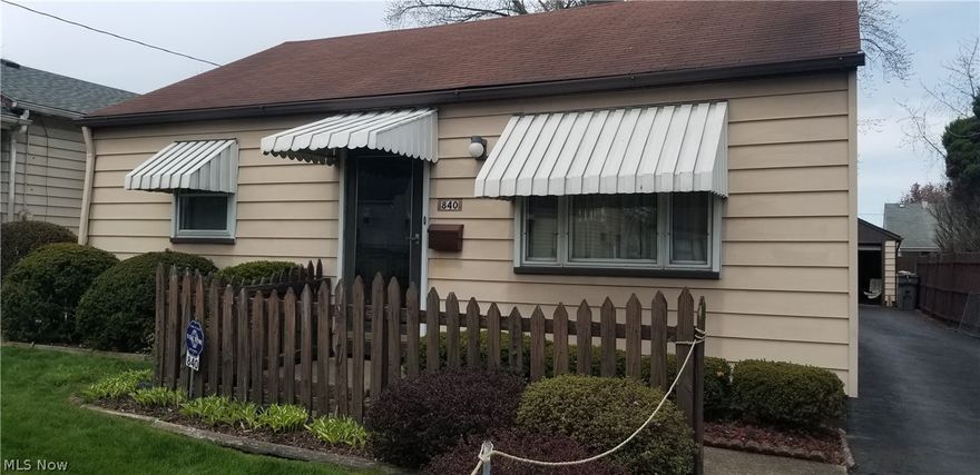 Just wait until you walk into this house! So much more than it looks from the street. 3 bedrooms, Living Room, Kitchen/dining area and a large L shaped family room that has sliding glass doors leading out to the bright, cheerful and clean enclosed Porch. Family room has artificial fireplace that stays. The home has been very well maintained, clean!  The yard is small enough for easy maintenance yet immaculately landscaped with floral beds. For any Car Buffs out there, the garage is 2 car wide with an extra garage addition to the back = 3 car garage. Great place to store  that historical vehicle or work/clean and shine your vehicles. This is truly a must see! The 90% efficiency Furnace as installed in 2009. Hot Water Tank installed in 2018. Bath updated in 2021 with a new vanity/sink and toilet. Blacktop driveway that is in great condition. Don't wait......