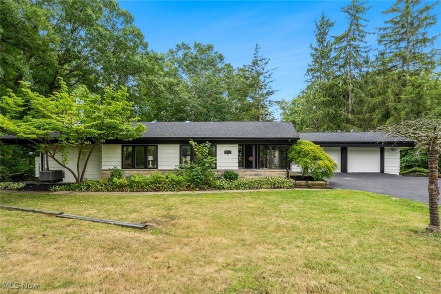 Discover a blend of luxury and comfort in this remodeled home, nestled in serene Moreland Hills, near Chagrin Falls. Inside, an open, airy floor plan with skylights fills every room with natural light. The living area, framed by large windows, offers picturesque views and a welcoming space for relaxation and entertaining. The modern kitchen boasts granite countertops, stainless-steel appliances, and a central island for casual meals or gatherings. The master suite is a peaceful retreat with a spa-inspired bathroom and spacious walk-in closet. Each additional bedroom is generously sized and filled with light, providing comfort and privacy. The cozy semi-private bar lounge is perfect for an evening drink or quiet reading. The finished lower level, with walk-out access to the lush backyard, is ideal for a family room, home theater, or gym. The exterior features a manicured lawn, expansive patio, and enclosed yard, perfect for summer barbecues or a safe play area for kids. Recent upgrades include a new roof, updated HVAC, rewired electrical, modernized bathrooms, and refinished hardwood floors. Located in a welcoming neighborhood close to top-rated schools and amenities, 15 Skyline Drive is move-in ready. Don't miss your chance—schedule a tour today and start your next chapter!