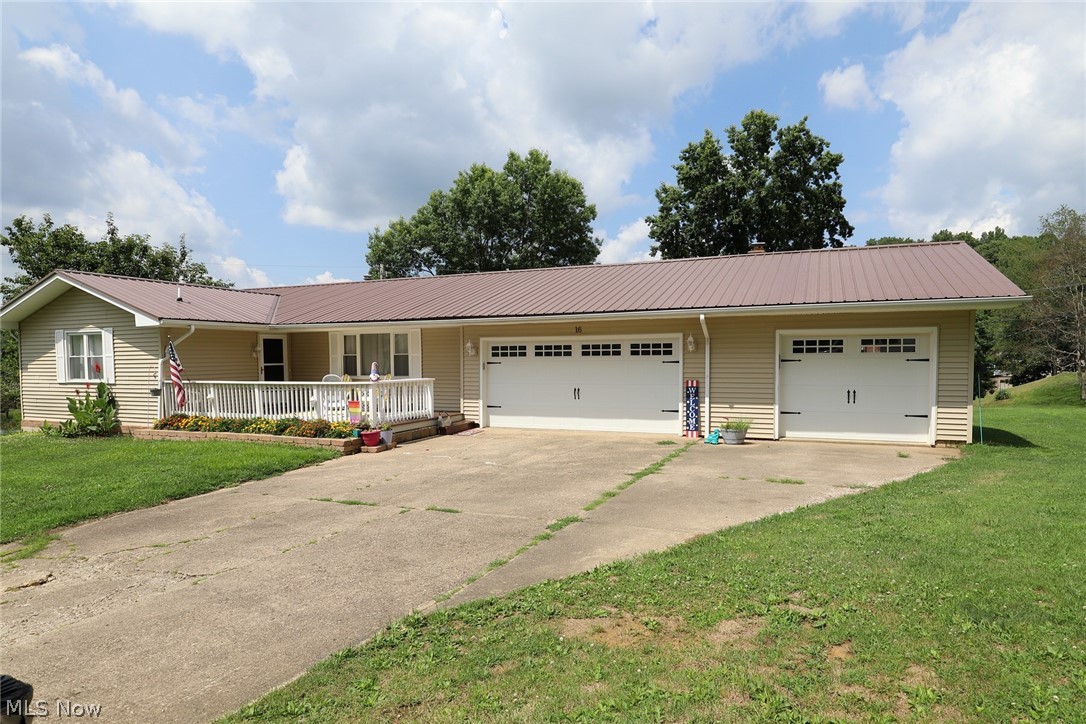 Big Value in this beautiful ranch located just outside of town in Coventry Estates. Pet approved with underground dog fence. Enjoy the mornings and evenings with your choice of front or rear decks. Kitchen is ready to go with updated cabinets & granite counter tops. Room for everyone with this 3 bedroom, possible 4th in the basement. Special feature includes the artistry of the custom wall design that is pretty fabulous in pink! Don't overlook the large primary suite. Finished basement is open to your imagination: media room, recreation area, or room to let the little ones run. Made more convenient with a lower level half bath. Has updated windows and an added feature you won't see but will appreciate year round when looking at your utility bills is the large amount of attic insulation. The metal roof was new in 2019 and has new garage doors in 2022. Furnace is 4 years old.