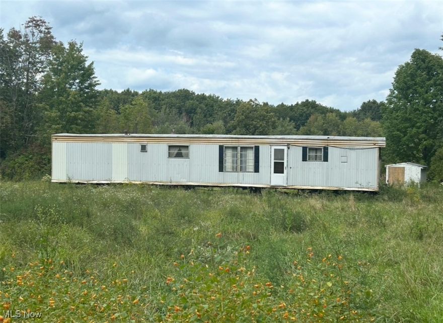 Located in Lindsay Gay Allotment is this large lot with a well, septic, electricity, and older manufactured home.  This property is across the street from Pymatuning Lake.  Enjoy the convenience of being close to the lake for fishing, boating, and swimming.  Priced to sell this property is ready for you to make  it your own get-a-way,