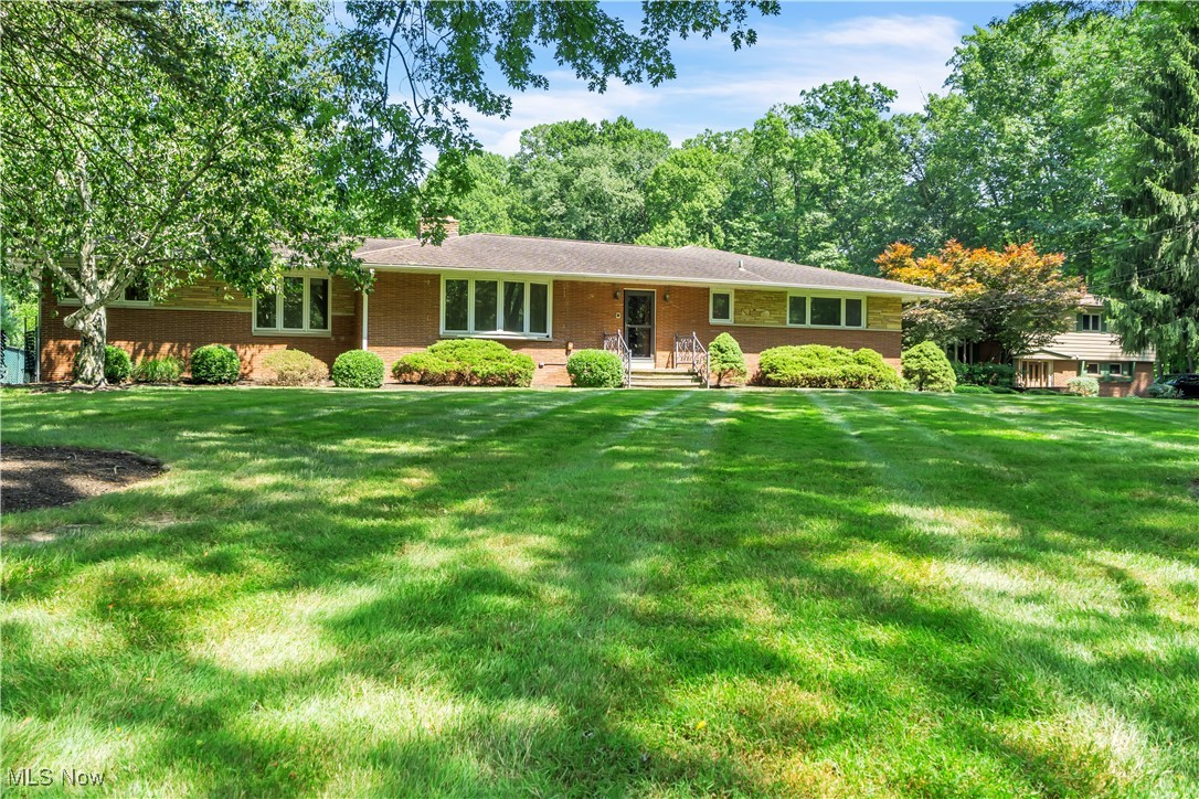 Welcome to 8001 Robin Lane—an exceptional 4-bed, 4.5-bath home nestled on 1.31 acres in Brecksville. Offering 3,538 sq ft above grade plus 3,231 sq ft of finished walk-out lower-level space, this property blends modern luxury with natural serenity.
The remodeled kitchen (2018) features quartz countertops, custom cabinetry with built-in step stools, a Wolf gas range, stainless steel appliances, and a widened picture window above a one-touch faucet. The sunroom opens to a stamped concrete patio with a louvered Pergola X roof and brick/sandstone steps—perfect for entertaining or relaxing in the park-like fenced backyard with 15+ mature trees (canopy) & a stone border.
The primary suite includes a spa-like bath (2019) with soaking tub, zero-entry shower, floating double vanity with under-mount lighting, and a custom California Closets walk-in. Hardwood floors, four fireplaces, Pella windows with internal blinds, and abundant storage add comfort throughout.
The expansive lower level, which could be used for an in-law or teen suite, includes a massive rec room, office, bonus room with a huge cedar closet, full bath, 2 storage rooms, and a secondary kitchen/laundry space with gas range, pantry, and fridge area—plus access to the lower patio from the family room. The attached 3-car garage includes a foldable ramp for wheelchair accessibility.
NEW major upgrades include a 7-zone boiler (December 2023), central A/C (2024), hot water tank (2024), and half bath toilet (2025). Additional features: glass block windows, newer ceiling fans, illuminated closets, a brick outbuilding with electricity, and a storage shed.
Ideally located on a very quiet street located just minutes from downtown Brecksville, Valor Acres, Metroparks, and the Cuyahoga Valley National Park—this move-in-ready home offers luxury, comfort, and a truly special setting. Don’t miss the interactive 3D virtual tour which includes the interior & the yard. Don't delay... schedule your tour today!