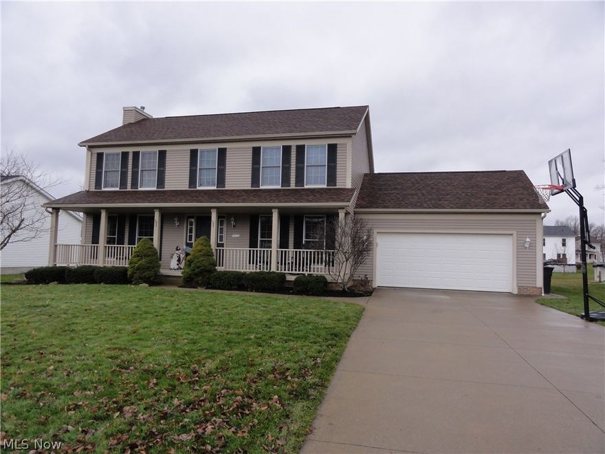 This immaculate 4 bedroom 2 ½ bath colonial is situated in a beautiful, elite neighborhood awaiting its new owners.  The curb appeal is evident, striking and inviting.  A sizeable front porch allows for peaceful enjoyment of the lovely community.  The kitchen is extremely functional and new quartz counter tops provide a stunning aesthetic.  The eat-in kitchen leads you through to the oversized living area, furnished with a stately stone fireplace.  The main floor is also fitted with a formal dining room.  The main floor bath has been completely remodeled; the tile floor is lovely and accentuates the bold vanity with marble top.  The main floor is well-appointed with a large laundry room and access to the attached garage.  This home is perfect for enjoying family as well as entertaining.  Sliding glass doors lead you to a newer 33-ft heated pool surrounded by hundreds of sq/ft of decking and the privacy fence allows for a feeling of seclusion on your own oasis.  More than 2/3rds of the