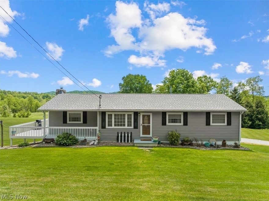 Introducing a place that needs no introduction, this property speaks for itself! A place where the grass is greener and yes, the sky bluer; 303 Sams Creek Rd. This beautiful sprawling 3 acre gem features a meticulously well cared for 3bd 2ba home with remodeled kitchen beautiful hardwood floors, spacious living room with fireplace, and large wrap deck. Downstairs you'll find a finished basement with conveniently located 2nd kitchen and a 2nd fireplace. Enjoy the relaxation and tranquility of the outdoors, indoors, within the adorable sunporch. The main house has his and her's attached garage stalls on each side of the basement. Outside you'll find 2 detached garages offering even more storage and parking for outdoor equipment, power tools, automobiles, you name it. Step behind the 1st detached garage and step into your very own private pool with wrap around deck. The neighbors are spaced so nicely apart you will feel like you are in another world. Don't miss this opportunity to call th