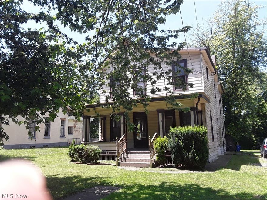 Great Opportunity for investors fenced area in back. Kitchen has wood floors, oak cabinets, island w/ sink, garbage disp. cupboards above for more shelving for easy access items. stove ref, dishwasher to stay. Dining room has hardwood floors with lead glass windows, French doors from DR area to LR with another ornamental FP. Upstairs has a room currently being used as a sewing room but could be used as a 3rd BR.Full bath has washer & dryer hook up w/ on demand water heater which will stay w/ property. Large BR also has orn. FP, several ceiling fans up & down stairs.2nd floor has eat in kits, garbage disp, plenty of cupboard space, stove and ref. dining room living room Property has 3 separate parcels 415-417 is duplex and river frontage 413 is vacant lot Water bill is combined for both units, gas & elec. have separate meters. Can be residential or multi family , live in one side and rent the other to help with your mortgage. Lot #5 is 30 x 125, lot #4 is 30 x 125, parcel # 81-50-98-07-