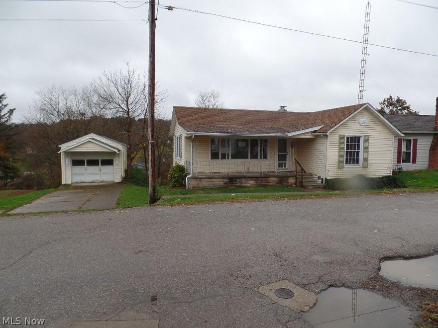 This quaint one bedroom and bath has a nice big yard and concrete front porch, with a one car garage situated at the side of the house and has a storage shed underneath for all  lawn care items. Off the kitchen and bedroom is a large living room with a wood floor.