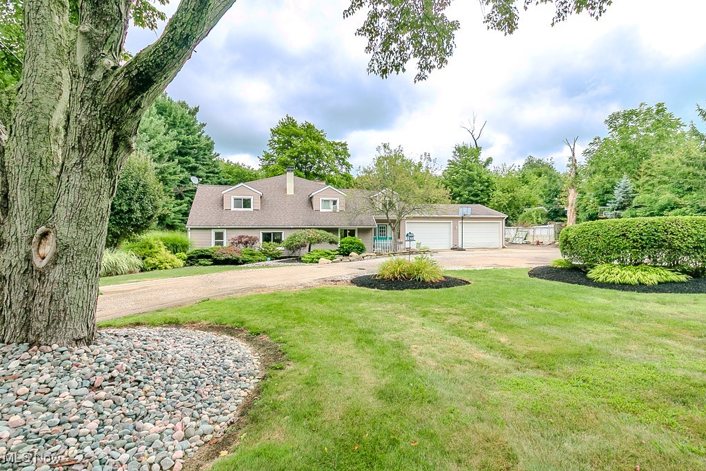 Discover this delightful 4-bedroom, 2-bath home nestled in the heart of sought-after Kirtland, Ohio. Offering 2,750 sq ft of comfortable living on 1.24 private acres, this property is designed for both relaxation and entertaining. Inside, enjoy two spacious living areas, a first-floor primary suite, and a flexible layout for today’s lifestyle. Outside, your own backyard oasis awaits—complete with an in-ground pool, a versatile barn, and a shed transformed into a charming chicken coop. All this in a welcoming community just minutes from schools, parks, and everyday conveniences.