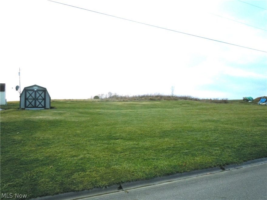 Just picture your New Home located in this Country Neighborhood....Best of All there is PUBLIC WATER AND SEWER........No Septic needed!!  There is a newer Shed on the lot and it will Stay......Relax in the country without the chore of maintaining lots of Land.  Comcast is available!