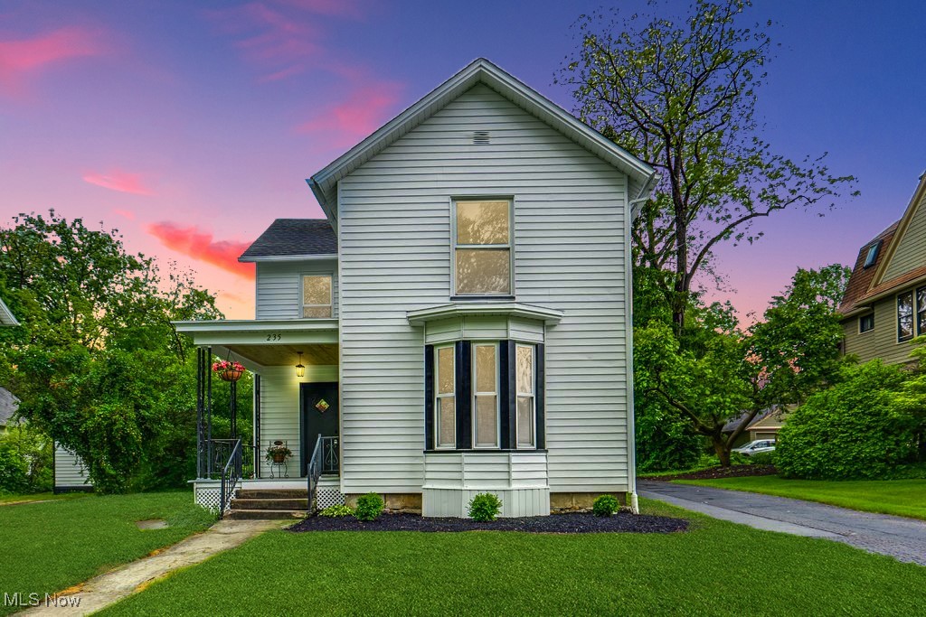 Step into a piece of history with this stunning 1890s farmhouse colonial, where classic craftsmanship is perfectly paired with modern elegance. This thoughtfully restored 4-bedroom, 2-bath home offers 2,014 square feet of charm and sophistication, nestled on one of the most sought-after streets in town—just minutes from campus, downtown, scenic trails, and the golf course. Inside, original hardwood floors have been carefully refinished to showcase their timeless appeal. The kitchen strikes the perfect balance between old and new with its original built-in hutch, Amish-made butcher block countertops, and a vintage-inspired farmhouse sink. The main level also features a convenient laundry space with cabinetry and practical storage. Both bathrooms have been elegantly updated with carrara marble countertops, 1897 clawfoot tubs fitted with showers, and sparkling crystal chandeliers—bringing spa-like comfort to everyday living. Unique period details continue throughout the home, including tongue-and-groove ceilings, authentic mortise locks, and walk-in closets—an uncommon find in homes of this age. Peace of mind comes standard with updated electrical, plumbing, a high-efficiency HVAC system, and a new water heater. The exterior impresses just as much, offering an oversized two-car garage with a dedicated office and workshop, a paved driveway, and a spacious backyard ideal for entertaining or relaxing. If you’re looking for historic charm blended seamlessly with today’s amenities, this farmhouse glam gem delivers it all. The craftsmanship and attention to detail truly set it apart. Don’t miss your chance—schedule a private showing today!