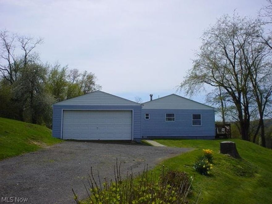 Deck on front and back of home with great views.  Country living in town. 2 BR Home features and equipped kitchen & main floor laundry and it is situated on a 1 Acre lot w/view of the Ohio River Valley.  Conveniently located between borders of Ohio & PA.  Minutes to both states. New roof - 3 months old