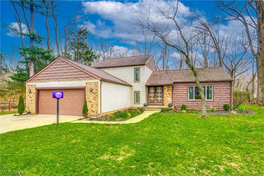 There's something special about a one owner home. It overflows with memories from the last 50 years and the pride and care of being owned by the same family is evident. Fall in love with the setting of this home as the .59 acre wooded lot ensures privacy and a peaceful place to call home. Not to mention the deer, wildlife, and creek that is the backdrop of the home. Admire the curb appeal of this 4-level split offering just under 2,200 square feet of finished space plus additional living options in the basement level of the home. A double door entry opens to a large foyer with two closets for great storage. The formal living room at the front of the home has newer carpet and a large window. This room is connected to the formal dining room with great views of the wooded backyard. Enjoy granite tops and all appliances in the eat-in kitchen with adjacent dinette. Sliding doors provide convenient access to the 16x16 deck and gorgeous backyard. The lower level includes a large family room with fireplace, 4th bedroom perfect for guests or an office, plus a guest half bath, and laundry room. At the end of a busy day, head to the upper level where you will find 3 more bedrooms and two more full baths. The owner's space has a spacious walk-in closet and ensuite bath. The beauty of a 4-level split is that you have a basement level for storage. Or, use it as the current owners did if you need an in-law suite as it features a kitchenette space, full bath, and separate sitting area. The extra wide garage and driveway are perfect for guests, teens, and friends to park. Get your steps in and take a walk to the nearby library, park, and schools. It's time for new memories to be made!