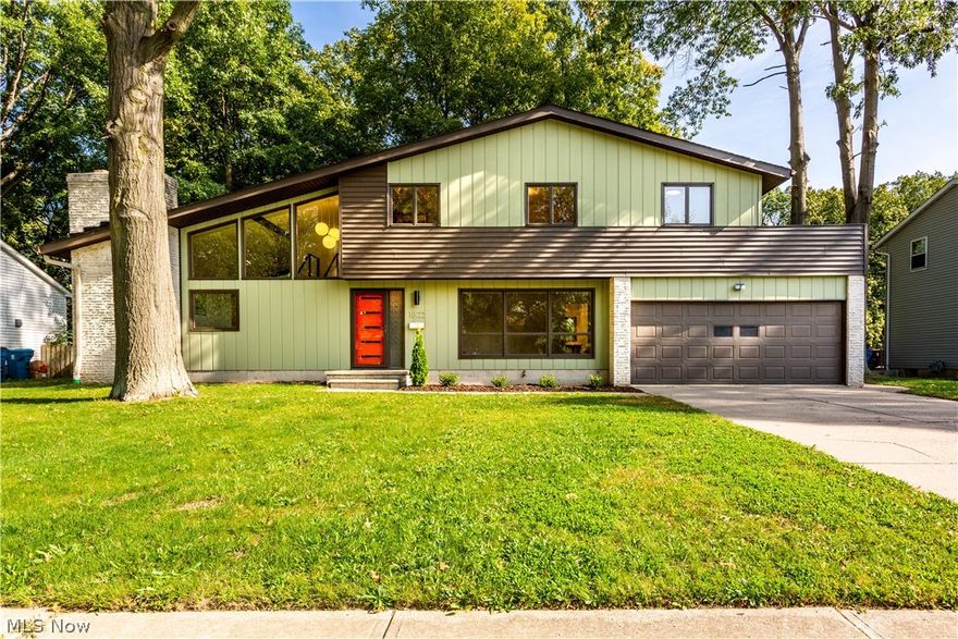 Stunning mid-century modern masterpiece designed by architect Samuel Paul and masterfully restored/renovated by a local Cleveland designer. Located in the Amherst school district on a wooded lot with a park behind, this home has the original mid-century appeal with multitude high end updates and over $150,000 in renovations. You will be immersed in the design and feel of this home the moment you walk in the door onto the new slate foyer past the floating staircase with new cable railings and sandstone planter and into the unique living room with vaulted ceilings, a massive sandstone fireplace, floor to ceiling windows and gorgeous new hardwood floors that lead into the formal dining room with new sliding patio door. The amazing kitchen includes new walnut cabinets, quartz countertops, terrazzo floor tile, and all new Bosch appliances that make this kitchen period correct but with all the modern amenities. A beautifully renovated powder room and a den complete the first floor. On the se