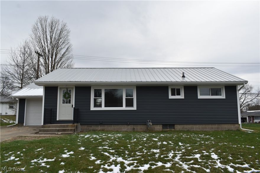 Checkout this completely renovated 3 bedroom, 1 bath and a half ranch home, located close to the Coshocton City Schools Campus. The updates include new metal roof and gutters and down spots, new vinyl siding, new light fixtures inside and out, new windows, new A/C, new doors and floor molding and all new flooring throughout the home. A new A/C, new garage door, new counter tops and new bathroom vanity, with new shower/tub insert as well as new paint throughout the home.