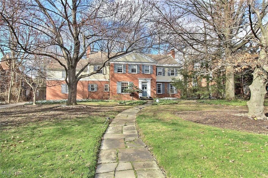 This beautiful 6-bedroom Colonial is set on a half-acre lot in Shaker Heights and offers an elegant flow with formal living and dining rooms, a sunroom, a first-floor office, and a beautifully updated kitchen. The spacious primary suite includes a walk-in closet and full bath, joined by an additional office, four more bedrooms, and two full baths upstairs. Additional highlights include a lower-level recreation room, a two-car attached garage, and a great backyard with a patio. Range and dishwasher replaced in the last couple of years. Ideally located just around the block from Shaker Heights Park and the scenic Upper Shaker Lake, it's minutes from award-winning public and private schools, less than 25 minutes to downtown Cleveland, and close to Case Western Reserve University, University Hospitals, Cleveland Clinic, and the cultural amenities of University Circle. Shaker Heights is one of the region's most sought-after suburbs, known for its tranquil atmosphere, exceptional city services, architectural beauty, and vibrant character.