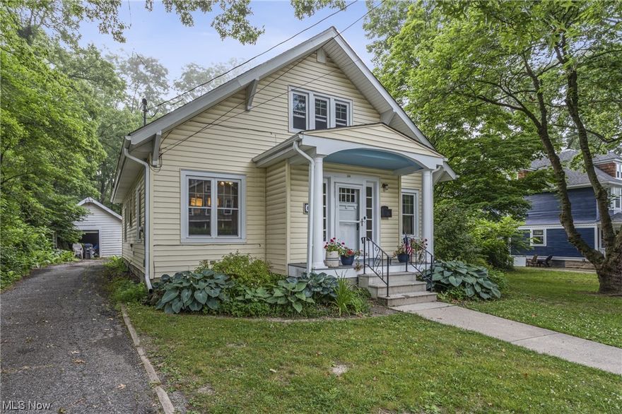 This must-see Bungalow on a spacious lot has the convenience of true one-floor living while offering the charm and character that only a century home provides! Within walking distance to Oberlin campus, downtown, parks, schools and the local grocery store! A small front porch leads into an enclosed vestibule with a built-in bench and a place for your hats & umbrellas. The vestibule opens into a large living room featuring a large bay window overlooking the side yard. Adjacent is an updated eat-in kitchen with plenty of countertops and storage cabinets, and leads onto an east-facing covered porch to enjoy the morning sun and the peaceful rear gardens. Off the living areas is a small hallway accessing two main bedrooms and a shared large bath with a tub and separate walk-in shower. The primary bedroom is on the rear side of the house while the front bedroom houses laundry in its large and deep closet. Upstairs,  a half bath and a large room extend living space with a hobby room/home offi