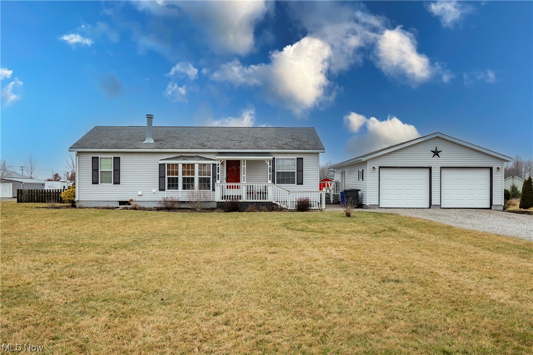 Welcome home to 242 Township Road 391! Don't miss this beautiful 3 bedroom, 2 bathroom ranch sitting on an oversized 1.5 acre lot with serene country views! Enter into the main living area boasting updates throughout and first floor laundry. New laminate flooring graces the entire home. The living room features a cozy fireplace and new recessed lighting that continues into the kitchen. The kitchen also offers new drop down lights, a dining area, and access to the back patio. Three great sized bedrooms and two full bathrooms complete the main level. The owner's suite sits privately on its own side of the home and features an attached bathroom with double vanities. Venture to the lower level to find a finished rec/family room. There is ample storage space on the LL along with a walk-out to the fenced in backyard. Your outdoor space also includes a large storage shed/barn. Notable updates include: new sump pump (2023), furnace and A/C (2017), HWT (2012), roof, windows, and kitchen appliances (2006). Schedule your private viewing today!
