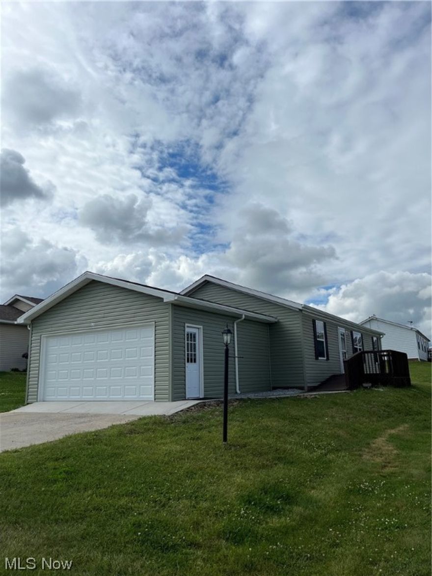 Charming 3 BR/2 Bath manufactured home located on a leased lot in a beautiful quiet community setting. Monthly lot lease is 300.00 and includes your lawncare, snow removal and garbage.