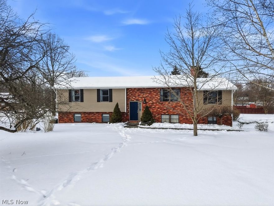 Welcome to 2190 Waterbury Drive, where thoughtful updates, space to breathe, freedom, and modern comfort come together on a beautiful ACRE corner lot in Uniontown. No HOA restrictions, a fully updated interior, a huge and usable yard! Get turnkey living without compromise. The main level features family room/den with a fireplace, living room, dining and kitchen, full bath and three bedrooms. The kitchen has been stylishly refreshed in 2024, featuring updated cabinetry, modern hardware, new sink and faucet, LVP flooring, and a contemporary back splash that brings the space to life. A full suite of appliances, replaced in 2023, makes this kitchen as functional as it is attractive—ready for everyday living and effortless entertaining. Lower level has walk out access, large rec room with new gas wall heater, laundry, garage access, bonus room, full bathroom. Each full bathroom has been tastefully improved. New carpet (2023) adds warmth and comfort throughout much of the home. A full interior paint update and new light fixtures in 2023 create a clean, cohesive feel from room to room. Step outside to enjoy the expansive one-acre property, complete with a large deck featuring brand new sliding doors and a gazebo that stays with the home. The space is perfect for relaxing evenings or hosting guests. Country feel without being far away.  The yard also offers a dedicated fully fenced section, ideal for pets, play, or gardening, along with a fire pit area ready for gatherings year-round. There is a two-car attached garage and large shed (15'W x 18'L x 16'H) for additional storage. Situated on a sizable yard off Killian and Waterbury, this bi-level offers both freedom and flexibility in a peaceful setting while remaining conveniently located near everyday amenities. Move-in ready, beautifully updated, and offering space inside and out—this is the one you’ve been waiting for.