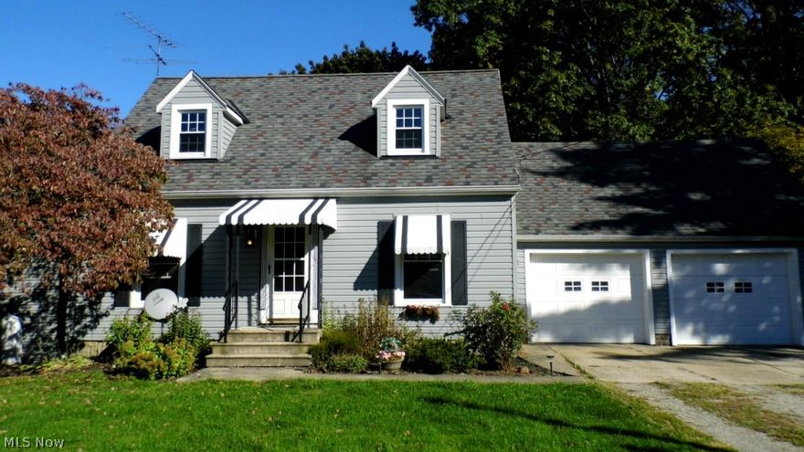 HUGE PRICE REDUCTION.  Cozy Cape Cod on 3.63 acres of wooded mature treed property.  Home has newer roof (complete tear-off), newer windows, newer aluminum siding, and newer remodeled addition of a large family room with gas stove.  Kitchen comes complete with all appliances including a brand new dishwasher and has Pine cabinets.  The formal dining room has a built in corner cabinet and hard wood floors.  The living room also has hard wood floors.  There are 3 nice sized bedrooms and 1 is on the main level and the other two are upstairs.  The full bathroom has been remodeled.  Basement was waterproofed by Ohio State Waterproofing and has a transferable warranty.  All the electrical has been updated.  The garage is attached and has two separate garage doors with openers.  Home being sold "AS IS" - seller will do no repairs.