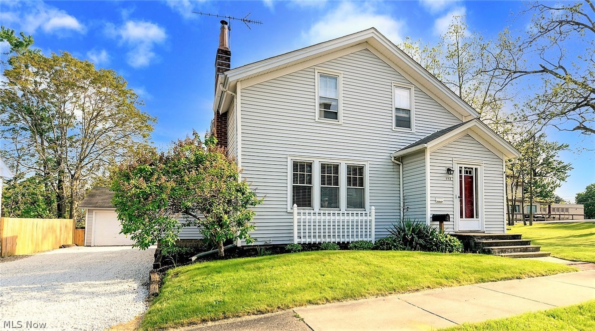 *Beautiful 3 Bedroom Home In Ravenna W/1,400+ Square Feet AND 4 CAR GARAGE!! *4 Car Garage Has 2 Car Parking + Raised Add On LARGE Area For Motorcycles, Atv's Or An AMAZING MAN CAVE To Enjoy Family Gatherings And Parties! So Many Uses ~ STANDOUT WOW Factor On This Property!! *Double Tier Entertaining DECKS Lead To The Garage *Long Driveway W/Fresh Gravel *Freshly Landscaped W/Great Curb Appeal! *NEWER VINYL Siding, ROOF Approx. 10 Yrs Old *NEW CARPET Throughout 1st Floor & Upstairs! *Walk In To A Foyer W/Double Coat Closets *1st Floor Showcases A Living Rm AND Family Rm- W/Cozy Fireplace & White Mantel, Crisp White Trim Around Triple Windows For Natural Light! *Dedicated Formal Dining Rm W/Crown Molding & Cut Out Kitchen View Raised Breakfast Bar Allowing Bar Stool Height Additional Seating! Ceiling Fan *BONUS Sunroom W/Dark Wood Flooring *The Kitchen Features Distressed Modern Grey Flooring, Is Fully Applianced & Has A Door To The Back Deck *Super Cool DOUBLE Stairway Entrance To 2nd