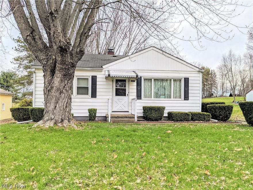 Adorable cottage style ranch on 1 acre in a convenient location close to Akron Canton Airport and many amenities!  This home has 2 nice sized bedrooms and living room.  Eat in kitchen opens to a huge family room with beautiful windows and views of appealing 1 acre yard.  Lower level has plenty of storage, workshop and nice recreation space.  Home is ready to move into!  Call today for a tour!