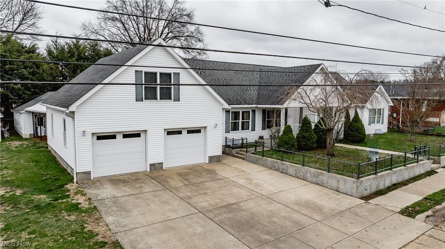 Lots of room to move around in the 3-bedroom 4 bathrooms, 3 full baths & 1-1/2 bath home. huge 21 x 33 finished room above the garage with gas heat available, great for a guest room or craft room, oversized heated 2 car garage, storage room, sink/water a back garage door to a HUGE work building / workshop with 220 electrics. Master bedroom large enough for a sitting area, has a side door leading out to a covered patio. Master offers two sinks a large walk-in closet a Jacuzzi tub and separate shower. 2nd and 3rd bedrooms are big enough for full bedroom sets. hall bath features a tub and shower combo. formal dining room with beautiful crystal chandelier. Sliders off the Living room leading out to patio. You will enjoy cooking in the very large kitchen lots of cabinet space, 3 lazy Susan's, solid wood cabinets, Corian counters. window over the sink, full appliance kitchen, new refrigerator, new washer and dryer. Full basement same size of the upstairs sq footage, ceder closet and two rooms with shelves, full bathroom with shower, basement has heat. New sub-pump, water softener, central vac, security system. Talk about curb appeal, large, covered porch, beautiful solid wood front door with beveled glass and side lights, front yard has green wrought iron fence, this home has so much charm.There is two Laundry rooms (one in the basement and one on the main floor) Natural wood baseboards and all solid wood doors. Anderson windows. furniture and NEW upright freezer negotiable.  OWNERS ARE LICENSED REAL ESTATE AGENTS.