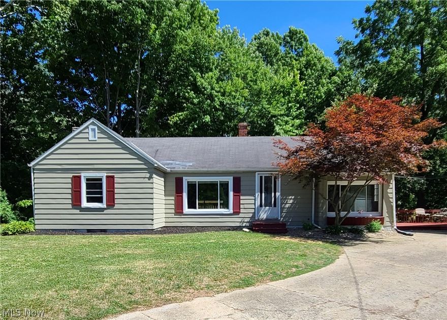 Endless possibilities await you with this unique 2,000+ square foot home. Enjoy the ease of one floor living in this 3 bedroom ranch. With hardwood floors throughout, classic brick walls, arched doorways and large windows, this home has plenty of character, charm and light. You’ll find custom accents around every corner, including  a gorgeous sink in the bathroom and shiplap ceiling in the bedroom. All appliances stay in the roomy kitchen, which opens to the dining room. Family meals can be spent gazing out of the large sliding doors and into the wooded backyard, or on the huge wrap around porch overlooking the river. The partially finished, spacious, walk out basement has a working fireplace, an additional bathroom, and plenty of storage space. It could even be used as a separate living area or master bedroom. A huge garage, shop and showroom, zoned light-industrial, provide all the capabilities you need to work from home. You’ll love this home’s park-like yard on a dead-end street. M