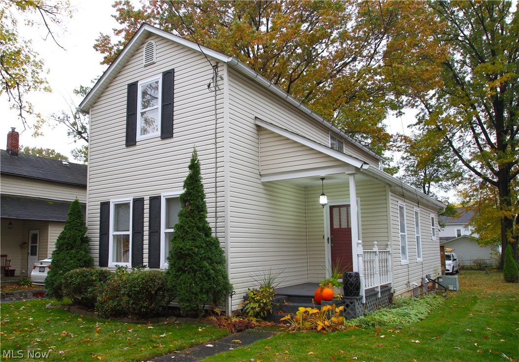 Great, well-kept Colonial with 1st floor bedroom and full bathroom! First floor also includes updated, applianced, eat-in Oak kitchen with maple floor, large living/dining room combination with crown molding. Updated first floor bathroom includes walk-in shower with sliding doors. Second floor has two more bedrooms and oversized full bathroom with step-in shower and jetted tub. You'll love the side porch that leads to deck in the back, where's there is a 2+ car detached garage (24x24) with extra parking space beside it. The walk-out basement has been waterproofed and includes a sump pump. Newer furnace and C/A. Hardwood floors under carpet. Home Warranty included. See this one today, make it yours!