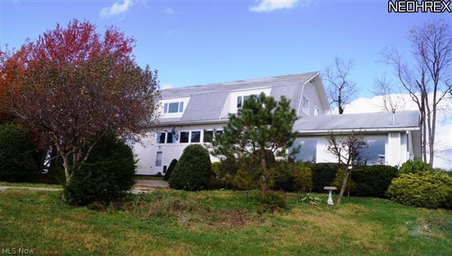 Unique, spacious, open living area, designed and custom built by owners with an urban/suburban look and feel.  Features include:  Gated drive, security system, hardwood & tile flooring, Corian countertops, super insulated, hi-efficiency, above average craftsmanship.  Gorgeous setting on 15.54 acres with an awesome panoramic view for miles.  Road frontage on Aster & Chalon totals 1504 ft. Designated tree farm offers CAUV tax reduction.  Attached to full main living quarters is an additional partially finished lodge style living space with a kitchenette.  Walls on first level can be removed to provide space for RV/Boat garage.  Also a 22 x 32 oversized 3 1/2 car garage. Exceptional home with multiple opportunities.  Two outdoor dog kennels.  Lots of wildlife!  All the mineral rights, including gas, oil and coal to the property transfer to the buyer with the sale, but the rights to receive oil and gas royalty do not.