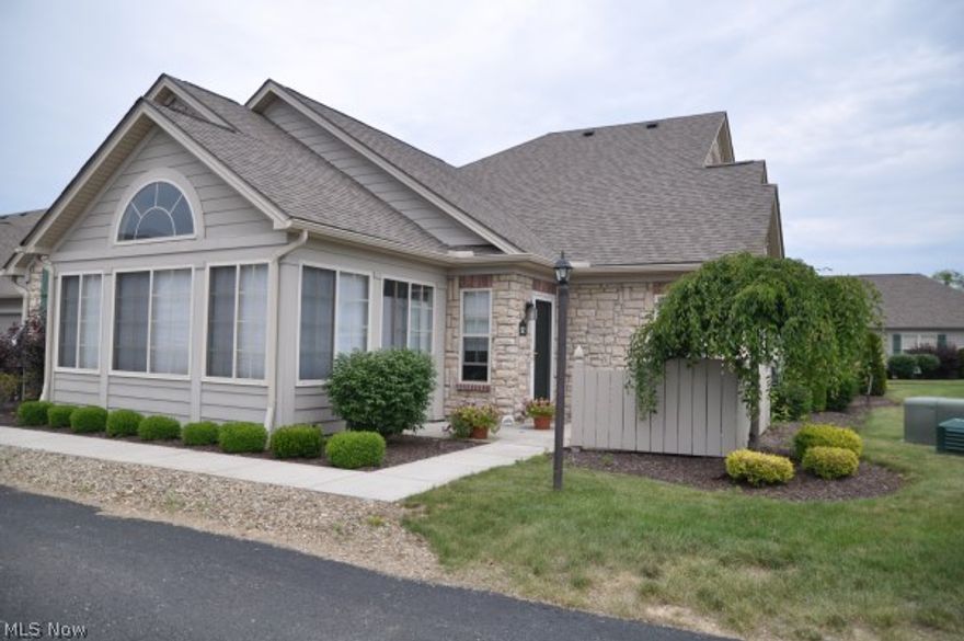 River Glen condo- spacious, open floor plan with circle-top windows & vaulted ceilings, large great room w/gas fireplace, 2 bedrooms, 2 full baths, master with walk-in closet, beautiful sun room, kitchen w/breakfast bar, first floor laundry, 2 car attached garage & brick patio. Carefree, single floor living.