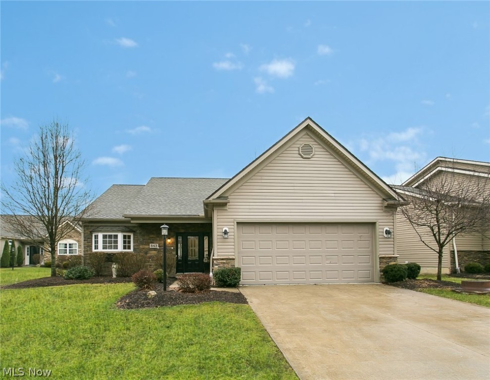 Desirable Freestanding Ranch Condo! The floor plan is very open and unique. The kitchen is spacious with a bay window, cherry cabinets and stainless steel appliances. It has plenty of counter space and many cupboards. The kitchen is open to the eating area and great room. There is also a wet bar perfect for entertaining. The great room has a gas fire place that creates a cozy feeling. The sun room is bright and cheery with cathedral ceilings. This room adds so much space and has many options. There are sliding doors for access to the wrap around deck. You will enjoy the generously sized master bedroom. The master bath has porcelain tile floors, a walk in shower, and an extra large walk in closet. There is a second bedroom and full bath as well. The second bath features a jetted tub. There is a 2 car attached garage. This home comes with a home warranty.