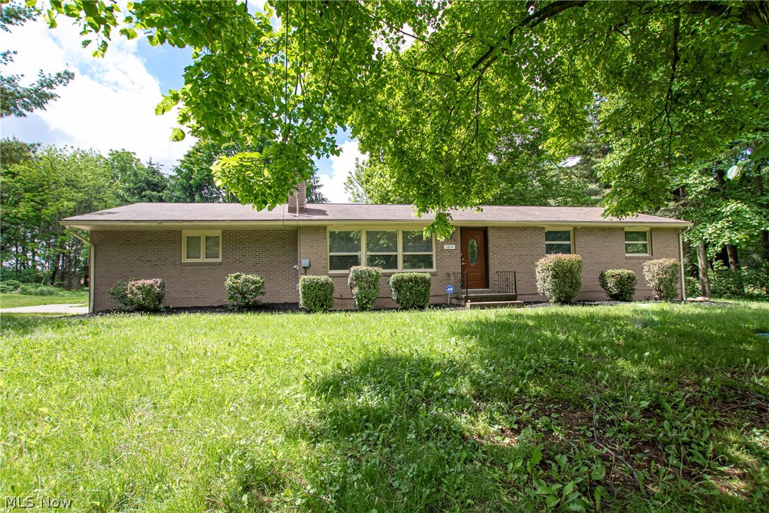 Amazing Willowdale Lake area home on cul-de-sac. Jackson Twp Schools. Over $100,000 of renovations were completed in 2018. They include a new kitchen with soft closed cabinets, stainless steel appliances (which stay), granite countertops, crystal lighting over the island with seating, recessed lighting, and an open concept to the living area. The living room features a wood-burning fireplace and the dining area has sliding glass doors to the patio. New hickory wood flooring throughout the main level and all bathrooms feature ceramic tile flooring. Newer ceiling fans in all bedrooms and decorative fans in the dining area. In the basement, you will find a spa-like bath with a step-up ceramic surround jacuzzi, and a separate shower. The finished basement has wall sconces and recessed lighting. There is also a separate living area, a fourth bedroom with a walk-in closet, and a newer luxury plank flooring. Septic system (2000 gallons) in 2012, plus many other updates - please see sup