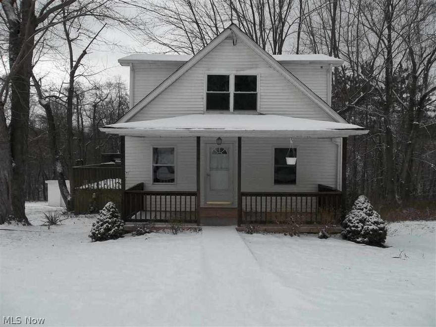 UPDATED CAPE COD- W/ COVERED FRONT PORCH, 12 x 17 DECK, 1 CAR ATTACHED GARAGE  & 3 CAR DETACHED GARAGE-ALL SITTING ON.65 Of AN ACRE. WON'T LAST LONG.