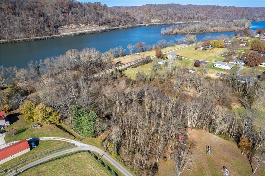 Partially Flat Wooded Lot Near the River – Minutes from Town! Enjoy the perfect blend of nature and convenience with this partially flat, wooded lot located just moments from the river. With a peaceful setting and a pretty hillside view, this property offers a versatile layout ideal for a future homesite, retreat, or investment opportunity. Property Highlights: Partially flat, wooded lot offering privacy and natural beauty. Close to the river—enjoy the scenery, recreation, and tranquility. Beautiful hillside views. Convenient location, just minutes from town. Easy access to shopping, dining, and local amenities. A wonderful opportunity to build in a serene setting without sacrificing convenience!