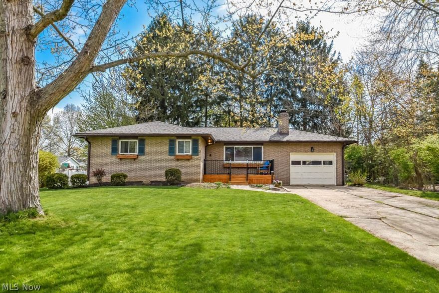 Welcome home to your updated brick ranch in Copley-Fairlawn school district!! Walk up your new paver walkway and restful front porch into your newly tiled foyer! The nice sized living room features a large picture window for tons of natural light and boasts a charming gas fireplace to cozy up to. The fully applianced updated eat-in kitchen will not disappoint! It has lots of soft close cabinets and drawers, convenient breakfast bar and french doors leading to your newly built deck. This ranch also includes 2 beautifully updated full bathrooms, 3 nice sized bedrooms with newly refinished wood floors. One of the bedrooms includes an en suite updated bathroom with a gorgeous walk-in shower with glass door! The full, walkout unfinished basement is plumbed for a third bath and is just waiting for the new buyer's personal touches! This home also includes an attached 1 car garage, a shed and picturesque backyard with beautiful park like trees for privacy! Close to parks, shops and schools thi