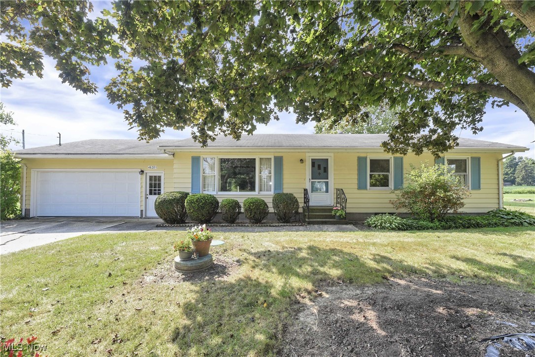 Prepare to be moved! Discover the charm and comfort of country living at 46201 State Route 303 in Wellington — a delightful 3-bedroom, 1-bathroom ranch nestled on over 1.5 scenic acres within the Wellington Exempted Village School District. From the moment you step through the front door, you'll feel at home as the foyer opens into a bright and welcoming living room, where a large picture window frames peaceful views and fills the space with natural light. The living room flows beautifully into a spacious dining room, perfect for gatherings, and thoughtfully separated from the kitchen by a charming pass-through wall. The open kitchen offers generous counter space, room for a cozy breakfast table. Just off the dining area is a conveniently located bedroom, with the primary bedroom right next door and an additional bedroom nearby. A centrally located full bathroom adds functionality to the comfortable layout. Downstairs, the full basement offers abundant space for laundry, storage, or potential future use. Updates include newer sump pump with battery backup and recently inspected septic tank. The attached two-car garage opens directly into the kitchen, making everyday tasks a breeze. With its blend of warmth, space, and serene surroundings, this property is a true gem—offering the best of rural charm just minutes from Oberlin and LaGrange.