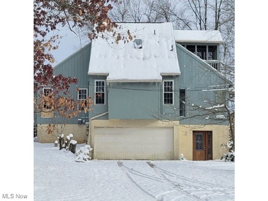 Spacious contemporary rambler on a beautiful .77 acre lot featuring vaulted ceilings, skylights, hardwood floors and a cozy fireplace. The open layout and large deck offer great flow for entertaining and everyday living. Home needs updating and repairs but offers incredible potential to create your dream space. With solid bones, architectural character, and a 2 car garage, this property is a fantastic opportunity for buyers ready to add their personal touch and build equity. Bring your vision and make it shine!