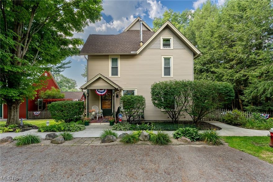 What an amazing opportunity with this beautiful colonial located in the heart of Mantua Village.  This home boasts comfort and charm as soon as you enter through the front door! There is original woodwork throughout - you won't want to pass up this charming farm house!  Enter into the home to a large living room, open-concept to the dining area, and additional sitting area off living room.  Large kitchen with center island is perfect place for guests to gather.  Porch  off kitchen is perfect for morning coffee and/or another gathering space as well.  Updated 1/2 bath next to kitchen and additional living space built out near rear of home.  Large deck off the back of the home leads to a private, above ground pool.  All bedrooms located upstairs and a spacious, updated full bath.  Full basement provides ample storage space plus walk out near laundry area.  Large barn has been updated with siding and roof, offers endless possibilities for the new home owners with 3 floors of storage available.  "She shed" has been updated as well as another outbuilding next to barn/shed.  2 car detached garage complete this beautiful layout with electric and French drain.  This home has been well maintained and is waiting for a new owner, call today to schedule your private showing before this one is SOLD!